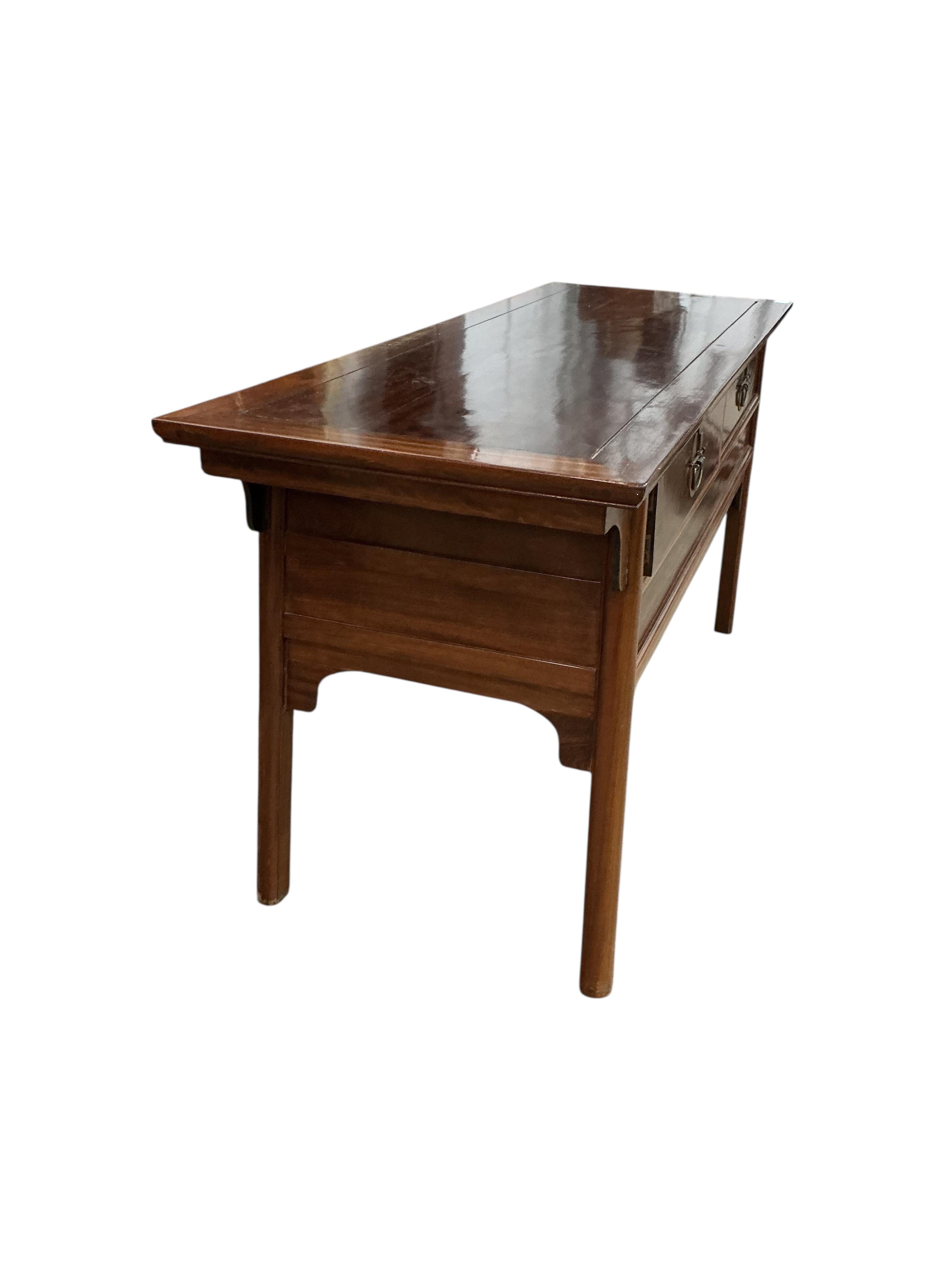 A Chinese hardwood two drawer serving table, width 172cm, depth 61cm, height 82cm